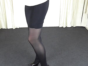 Shemale in black pantyhose & tight skirt