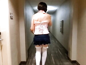 Follow me down the long hotel hallway to the ice machine to fill my bucket.  Wearing sexy stockings, corset, mini skirt and high heels.  Flashing my chastity cage and ass for the woman behind the camera.  Very fun and sexy video.
